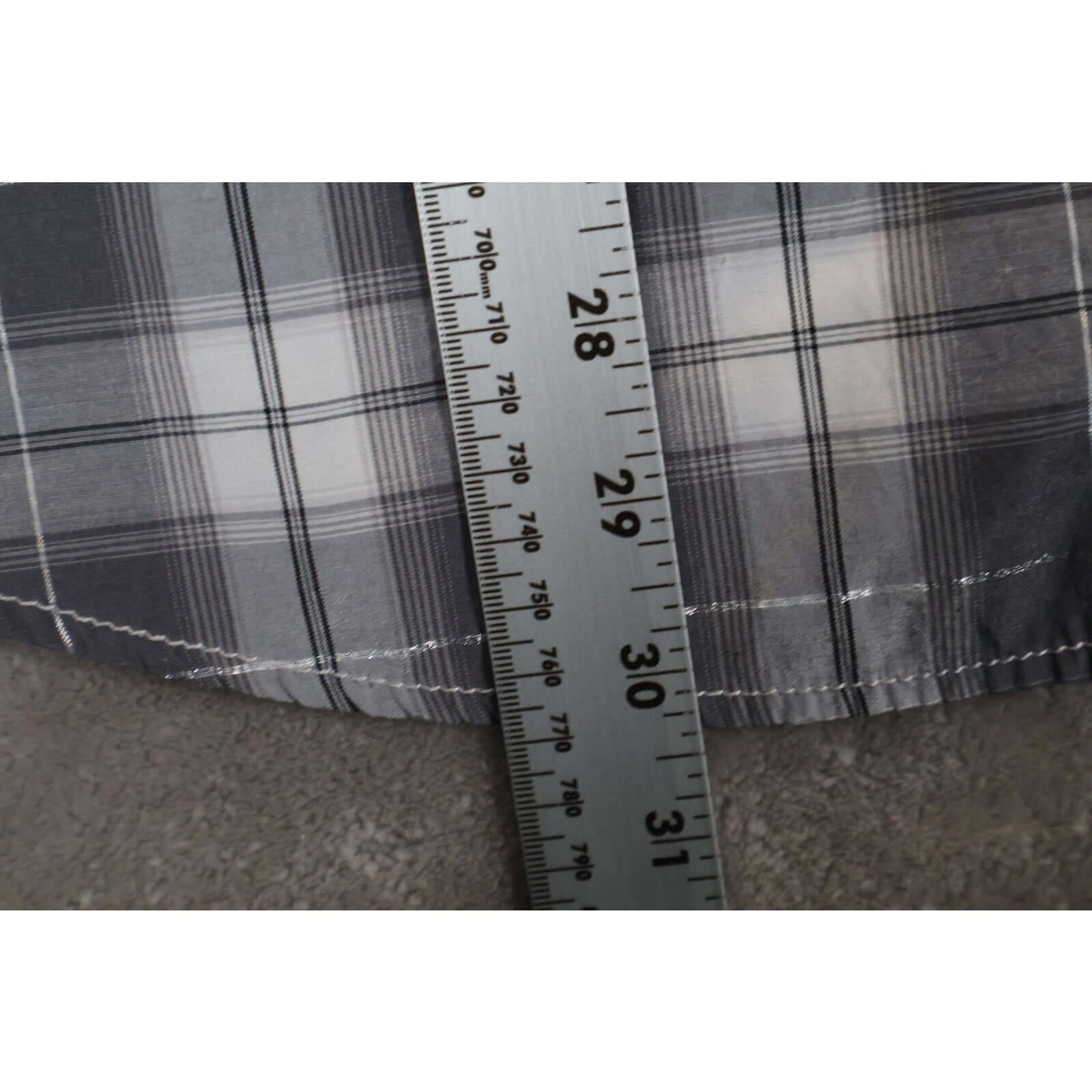 Attrak Jeans Shirt Mens Large Blue Gray Plaid Western Pearl Snap Short Sleeve fabric close-up with measuring tape.
